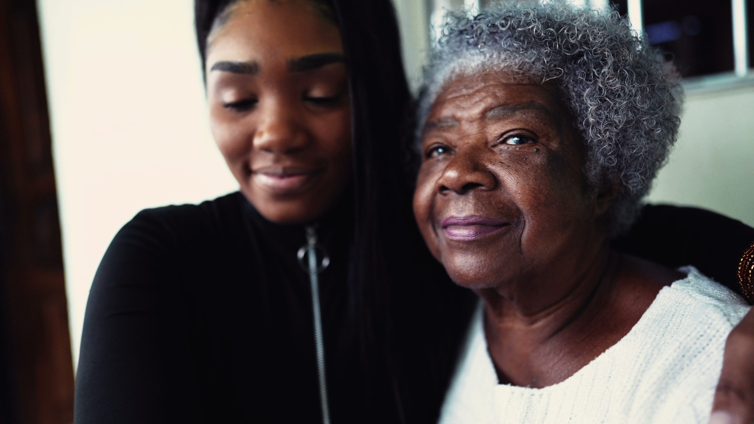 African,American,Granddaughter,Hugging,Elderly,80s,Grandmother,Showing,Support,And